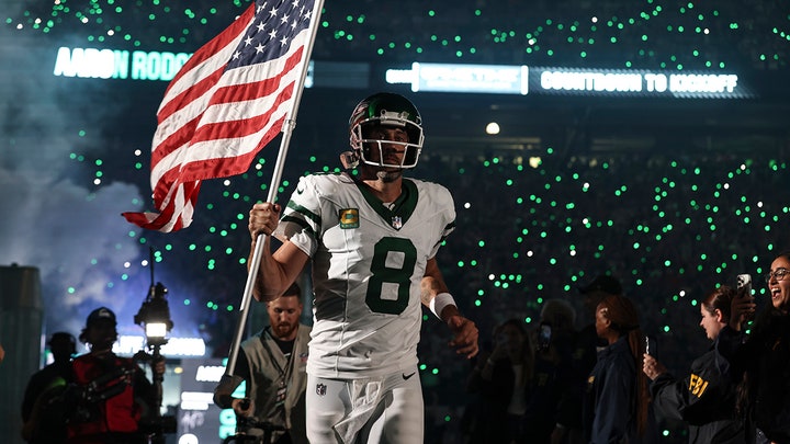 Aaron Rodgers of the New York Jets takes the field prior to a game against the Buffalo Bills at MetLife Stadium on September 11, 2023, in East Rutherford, New Jersey. (Michael Owens / Getty Images). From https://www.foxnews.com/sports/jets-owner-shares-video-aaron-rodgers-carrying-american-flag-important-message-fans